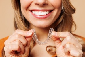 woman smiling with a aligner (clear)