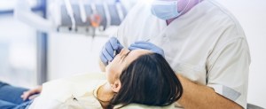 Patient receiving dental cleaning
