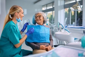 Dental hygienist treating patient
